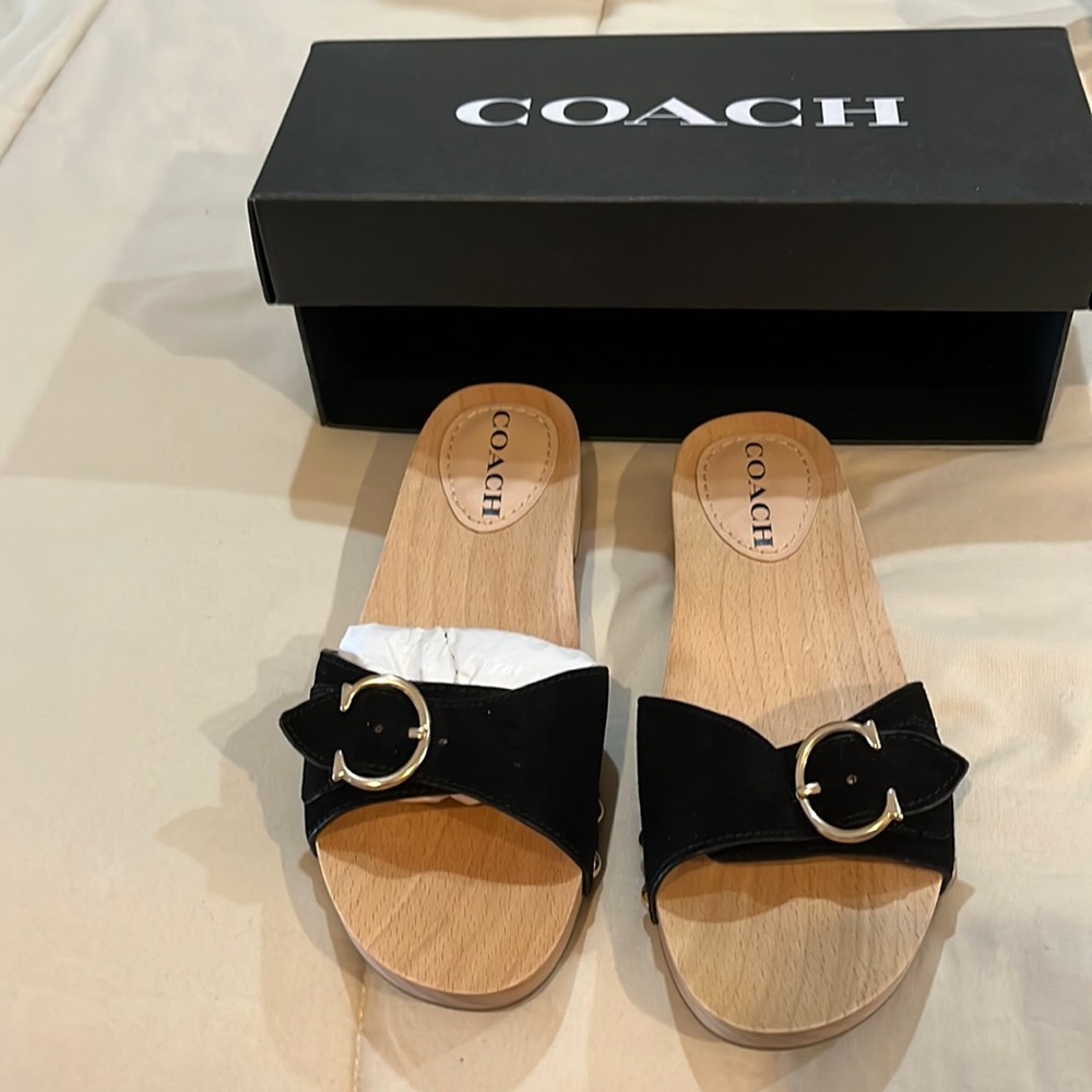 Brand new in box. Black suede Coach slip on sandal